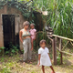 The author, holding her son as her daughter stands in the foreground of one of the “spooky Trini sites” where they sometimes tell stories at night.
